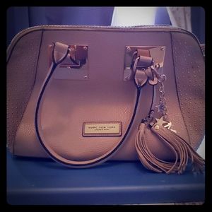 Tan colored double pocket zip close hand bag